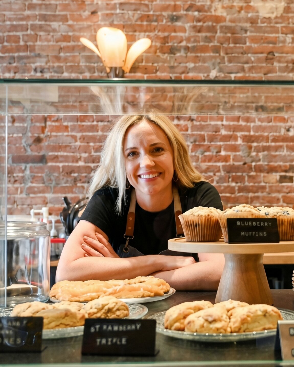 Kaitlyn Schlacks, founder of Sage, behind the pastry case